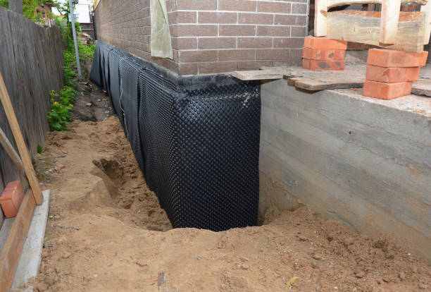 Happy homeowners after waterproofing job in Port Byron